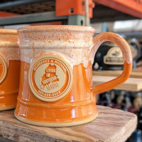 orange custom coffee mug with logo