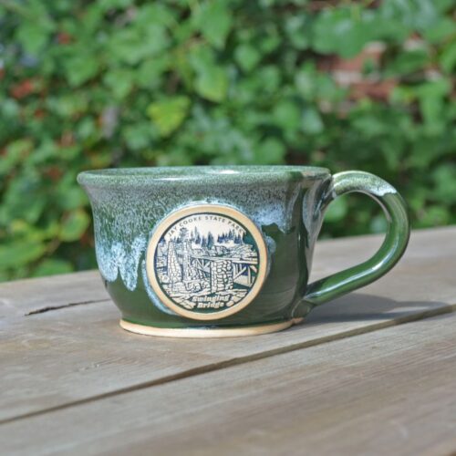 green handmade soup mug with logo