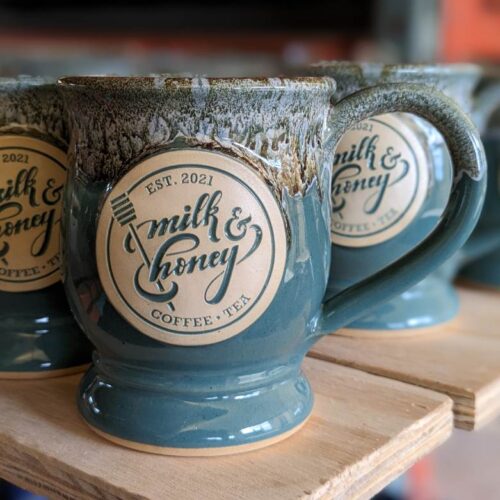 teal custom coffee mug with logo