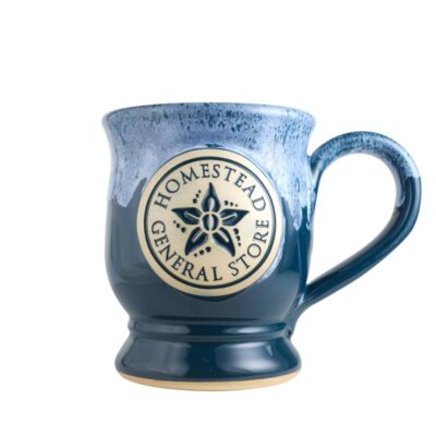 12 oz pedestal style coffee mug in a peacock with white rim glaze