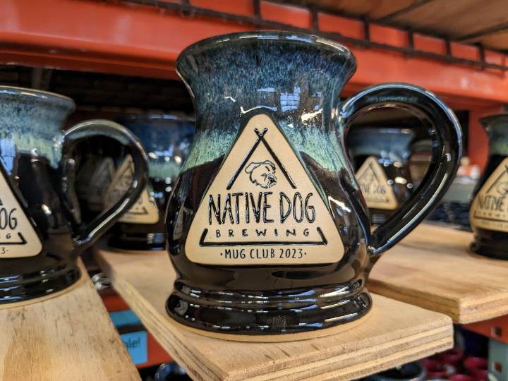 Dark blue beer stein with image of a dog and the text "Native Dog Brewing Mug Club 2023".