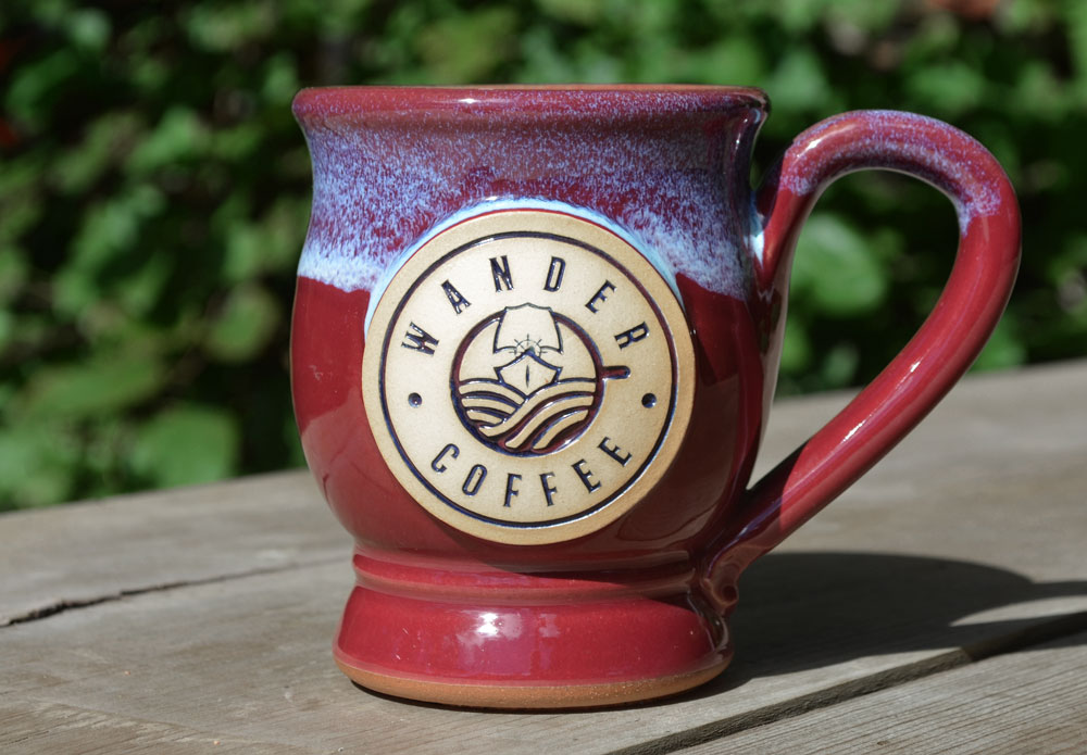 https://greyfoxpottery.com/wp-content/uploads/2018/10/wholesale-coffee-mugs-two-tone-glaze-wander-coffee.jpg