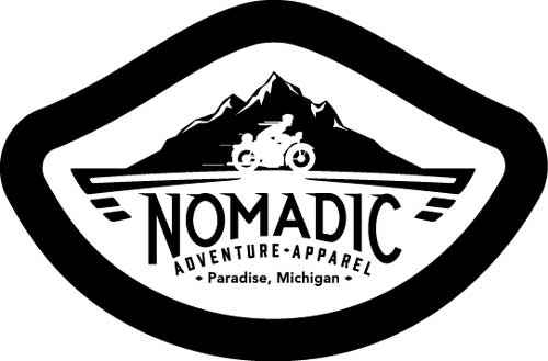 Illustration of a person riding a motorcycle in from of mountains with the text "Nomadic Adventure Apparel, Paradise, Michigan".