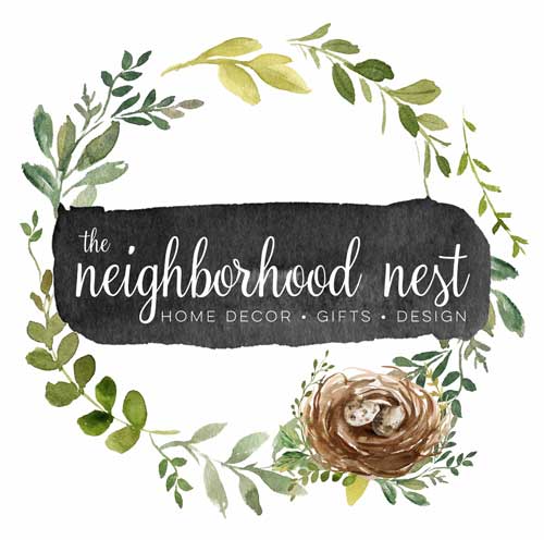 Illustration of a wreath of leaves with a small birds nest with the text "the neighborhood nest' in the middle.