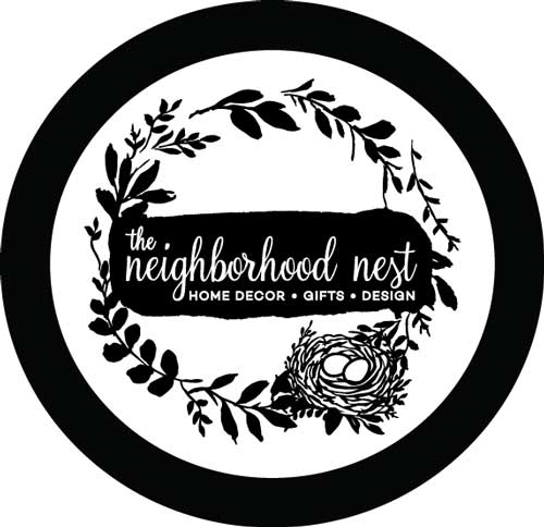 Black and white Illustration of a wreath of leaves with a small birds nest with the text "the neighborhood nest' in the middle.
