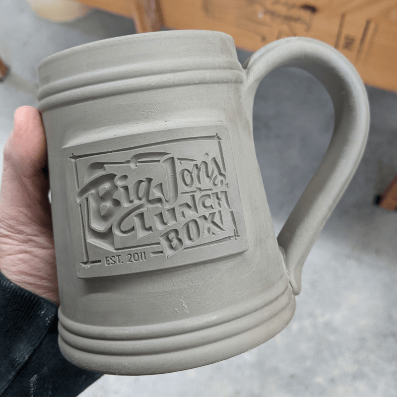 clay beer stein big johns lunch box logo