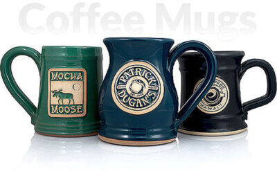 Group of three handmade custom coffee mugs.