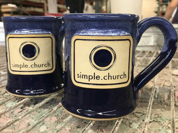 Dark blue coffee mug with "Simple Church" logo.