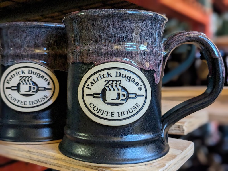 black wholesale coffee mug with logo for a coffee shop