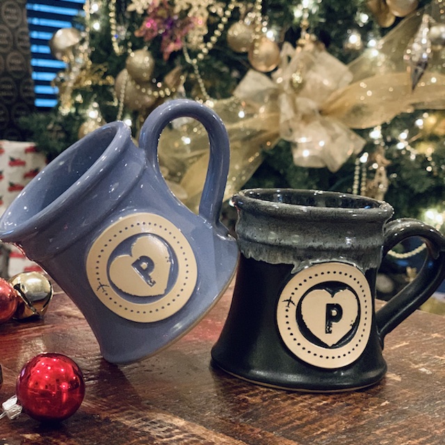 purple and black coffee mug with 'p' and heart image in the center